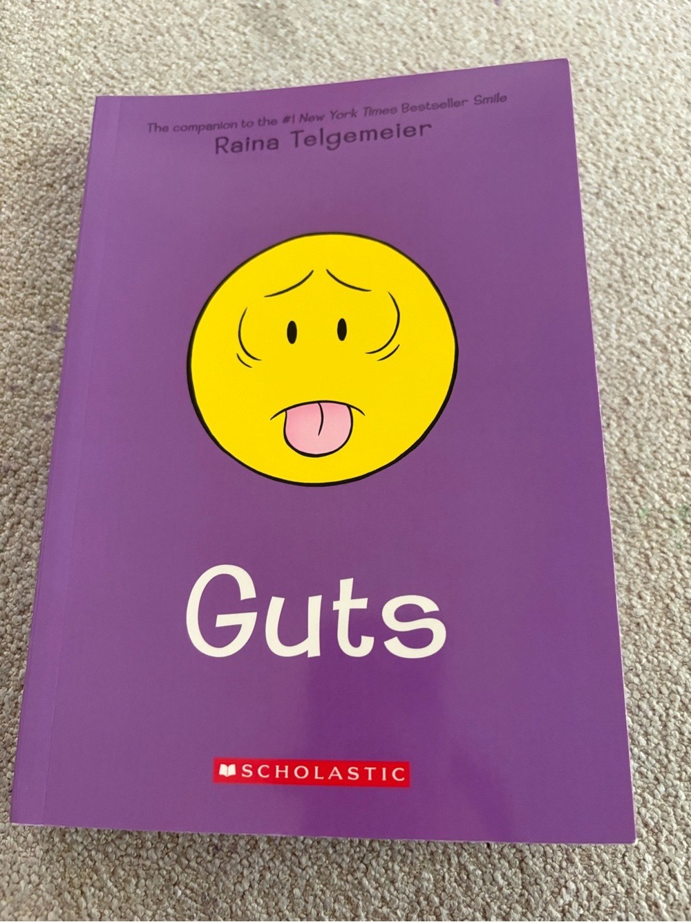 Scholastic Purple Cover with Yellow Emoticon